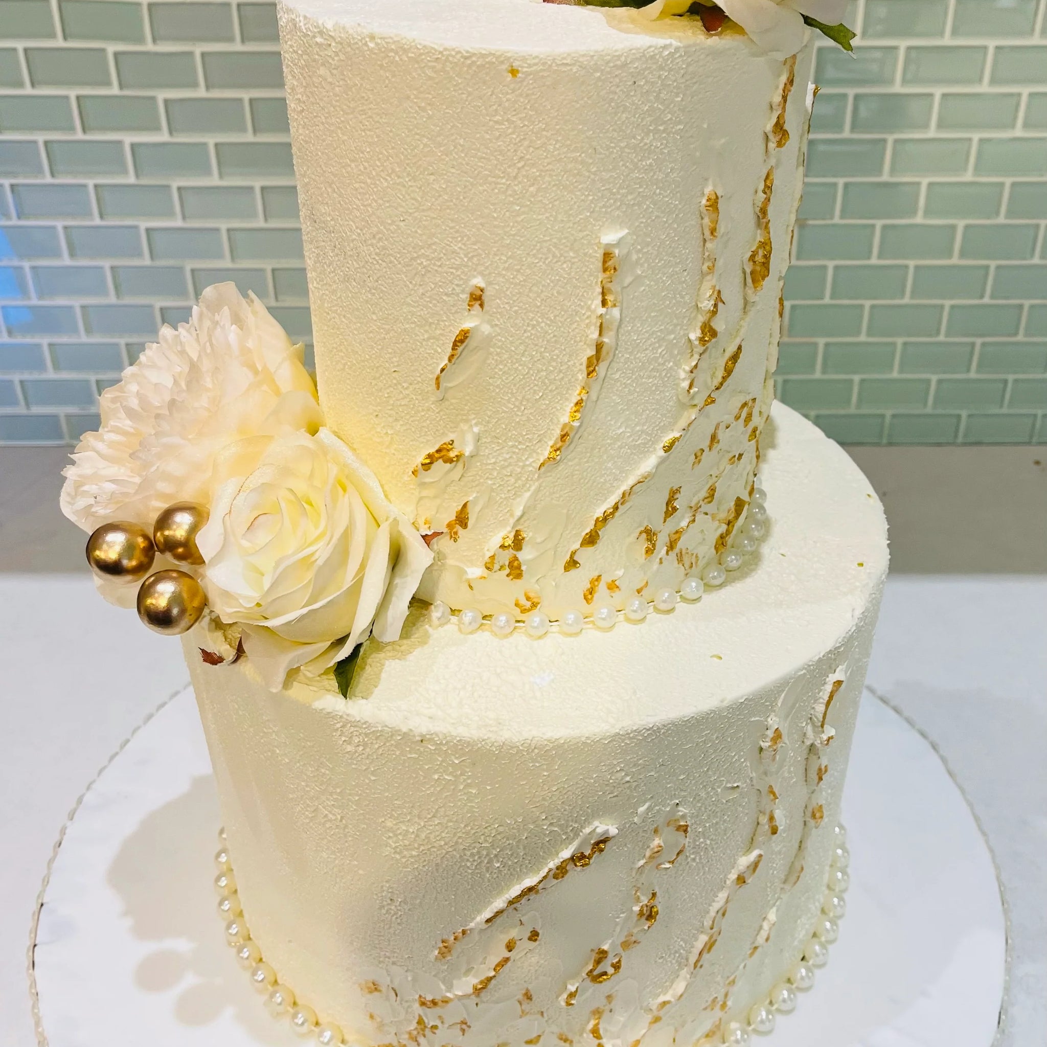 IVORY AND GOLD WEDDING CAKE