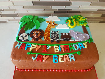 Animal theme 1st birthday fondant cake