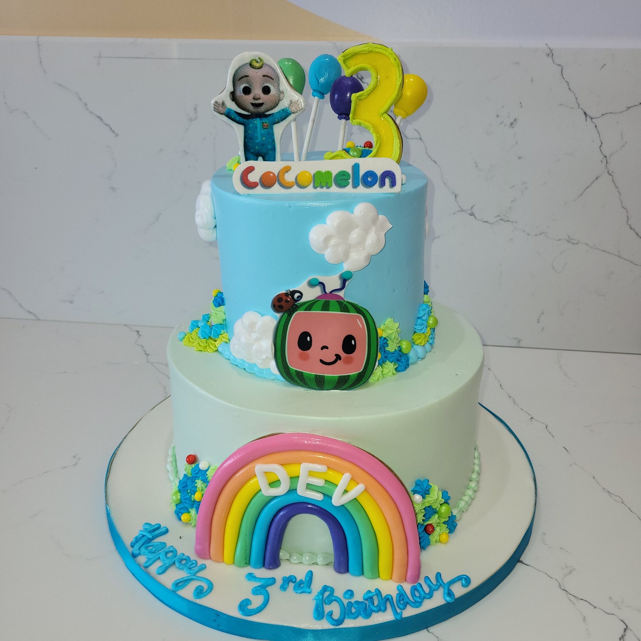 COCOMELON TIERED CREAM CAKE