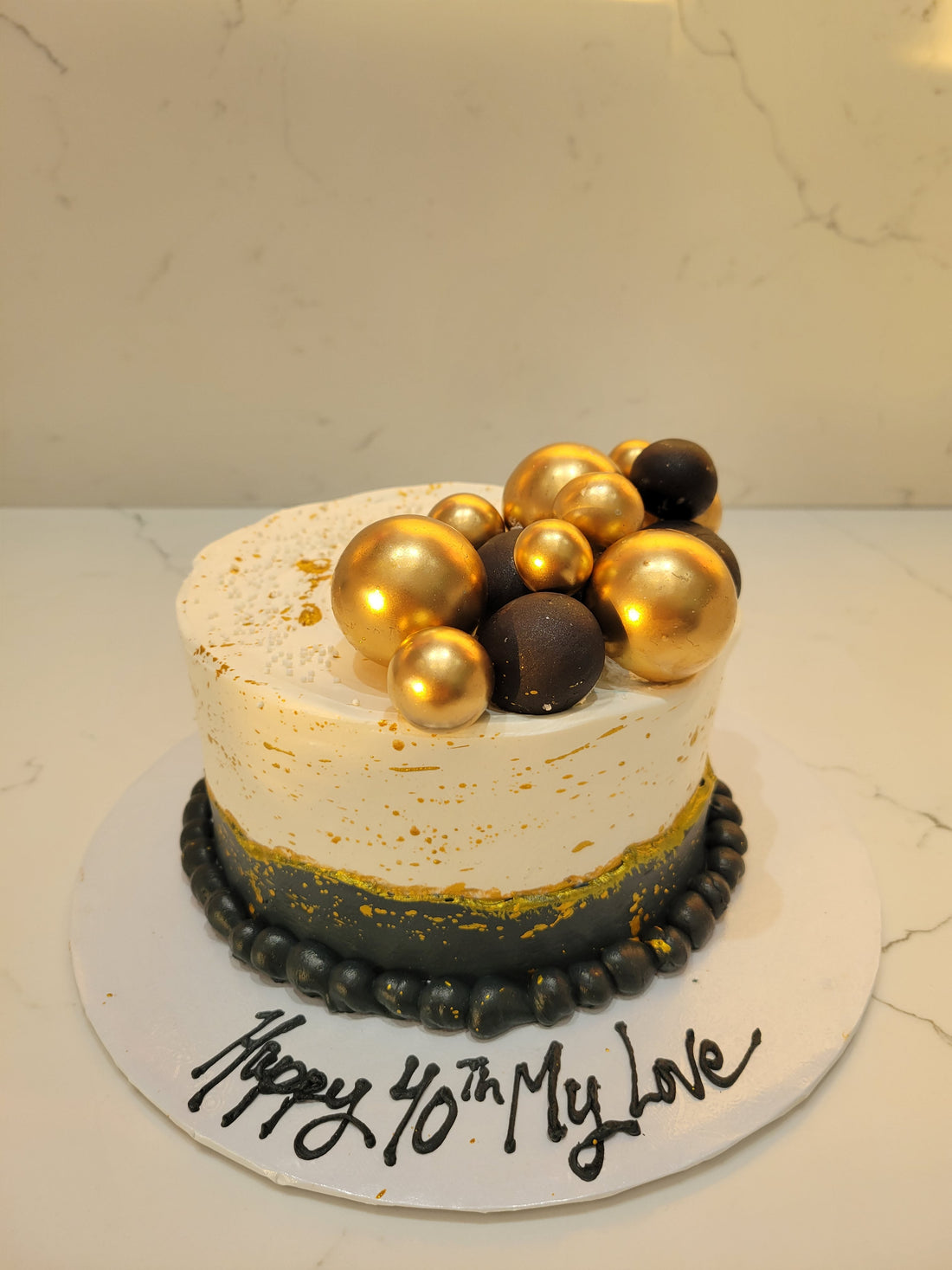 STACEY BLACK AND GOLD CAKE