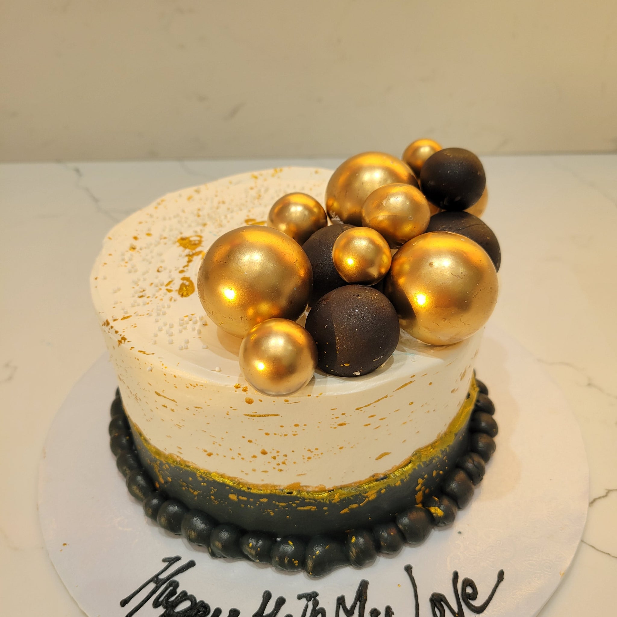 STACEY BLACK AND GOLD CAKE