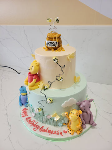 AKASH WINNIE THE POOH CREAM TIERED CAKE