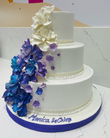 PURPLE & BLUE CASCADING FLOWERS WEDDING CAKE