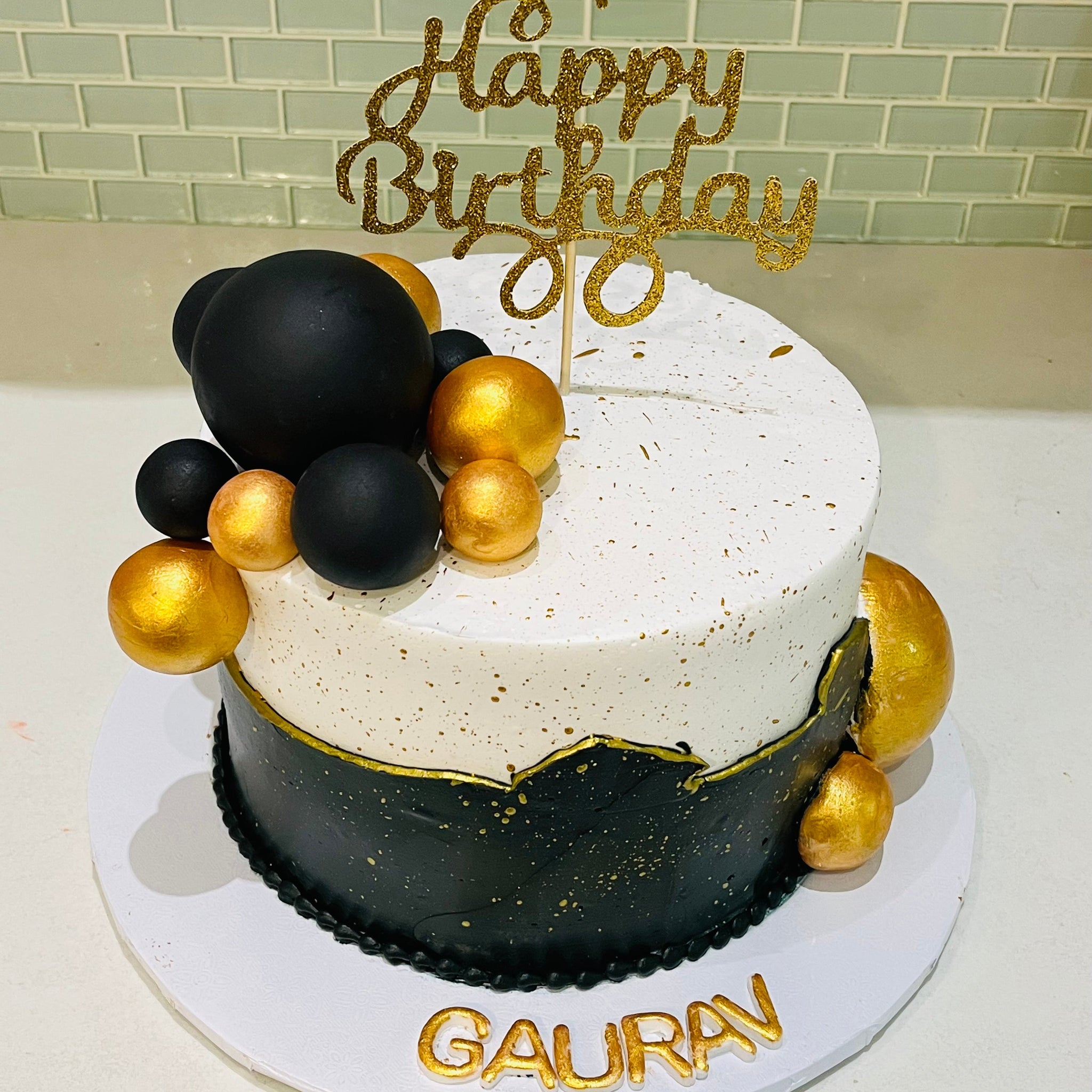 GAURAV BLACK AND GOLD BIRTHDAY CAKE