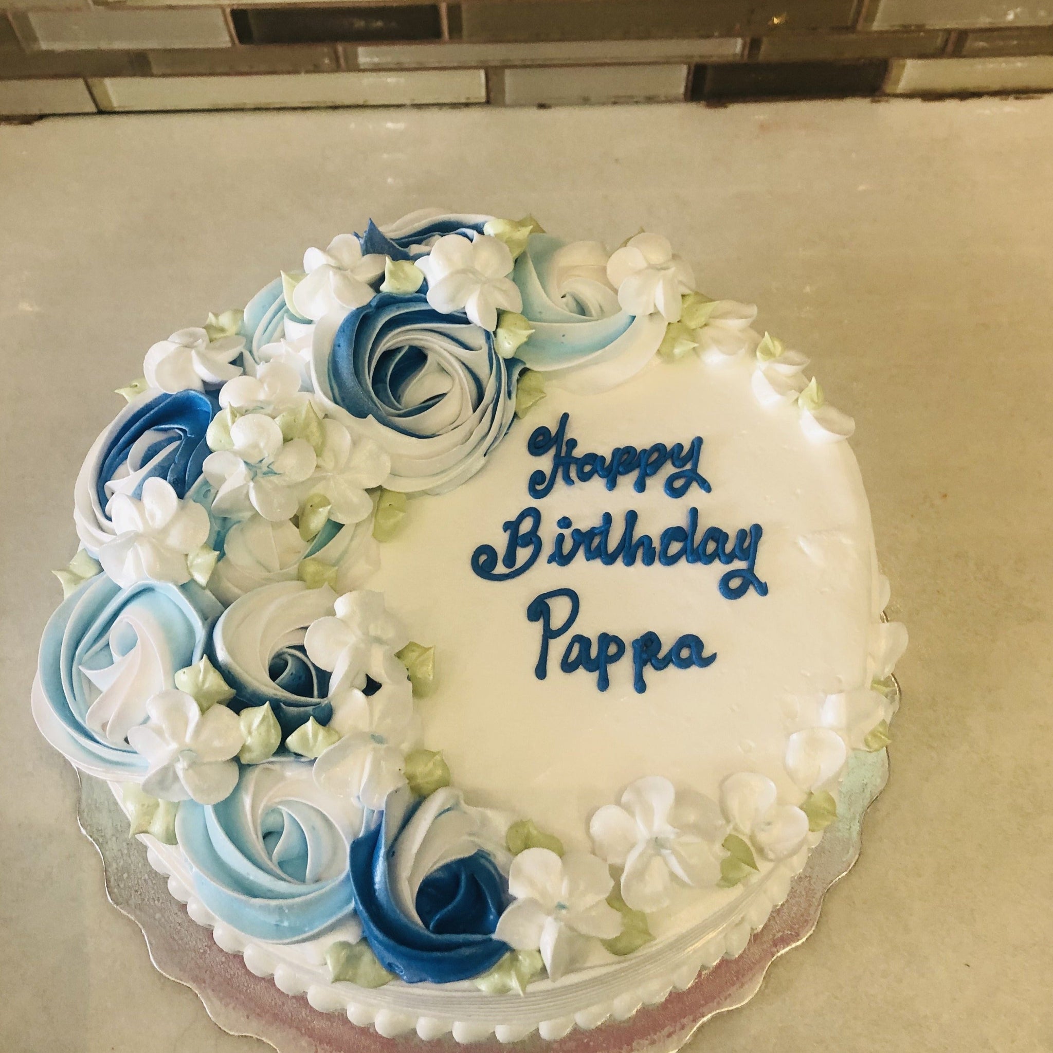 BLUE ROSETTE CREAM CAKE