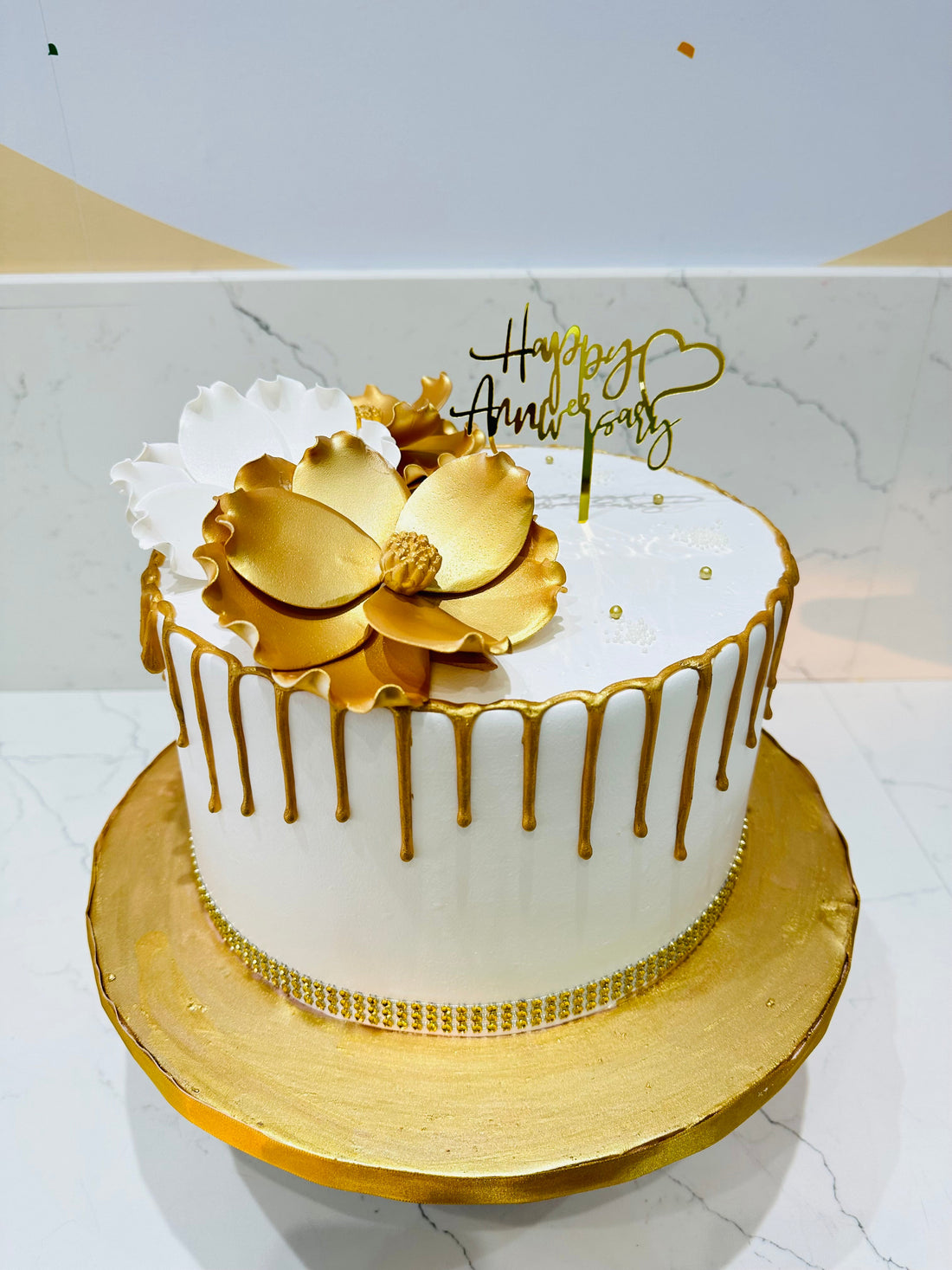 WHITE & GOLD ANNIVERSARY FLORAL CAKE