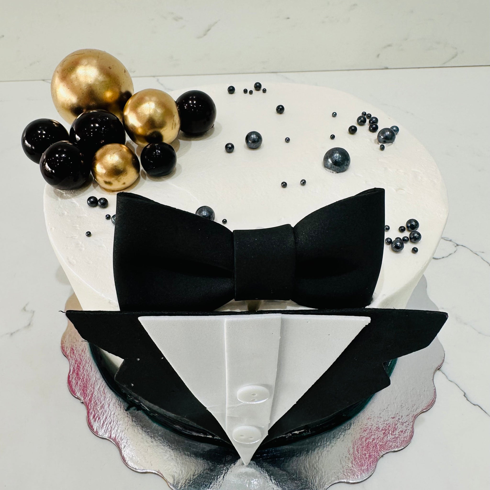 TUXEDO BLACK AND GOLD CAKE
