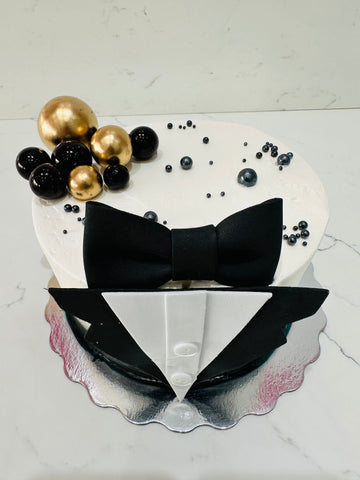 TUXEDO BLACK AND GOLD CAKE