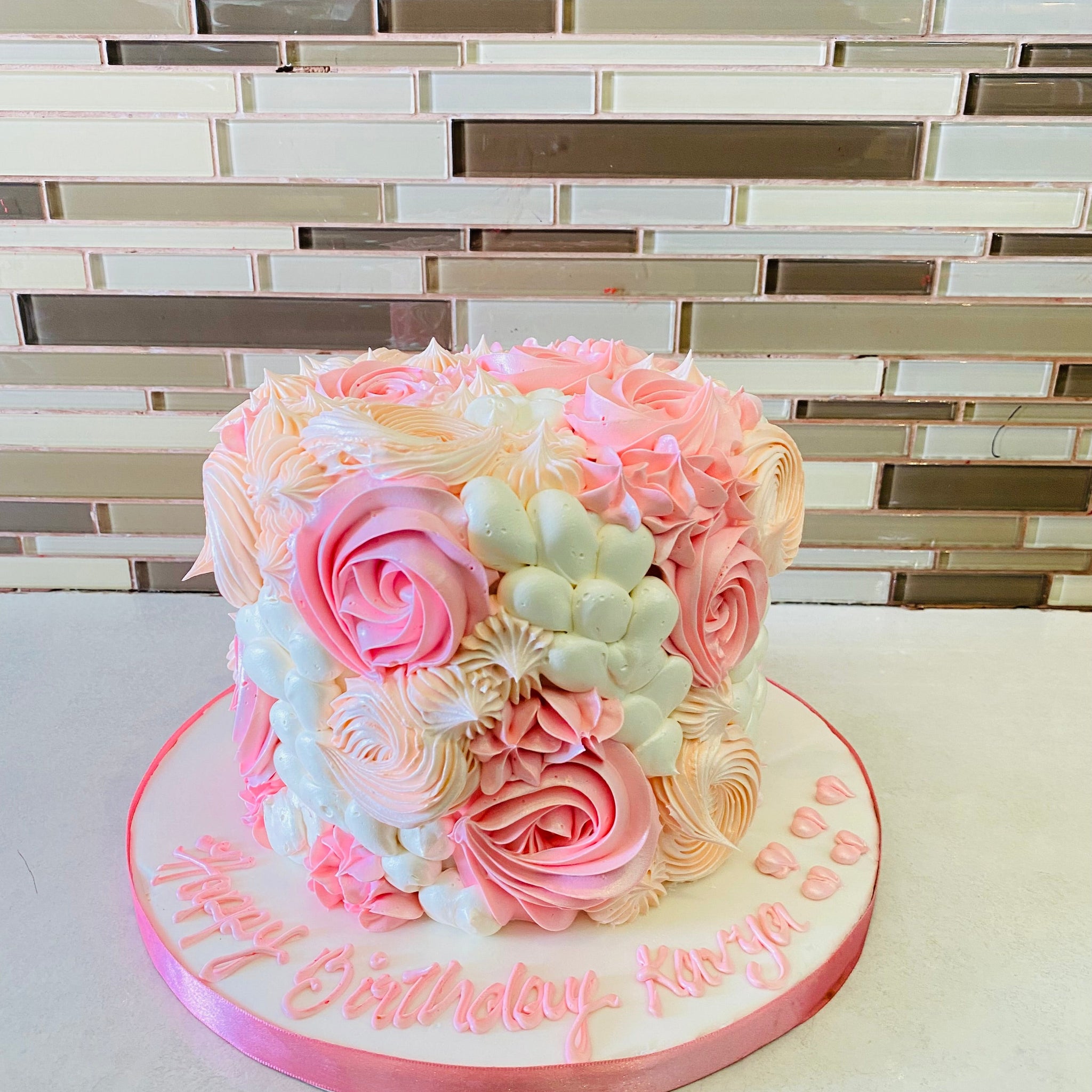 PINK AND IVORY CREAM ROSETTE CAKE