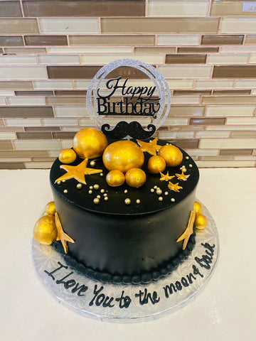 BLACK AND GOLD MOUSTACHE CAKE