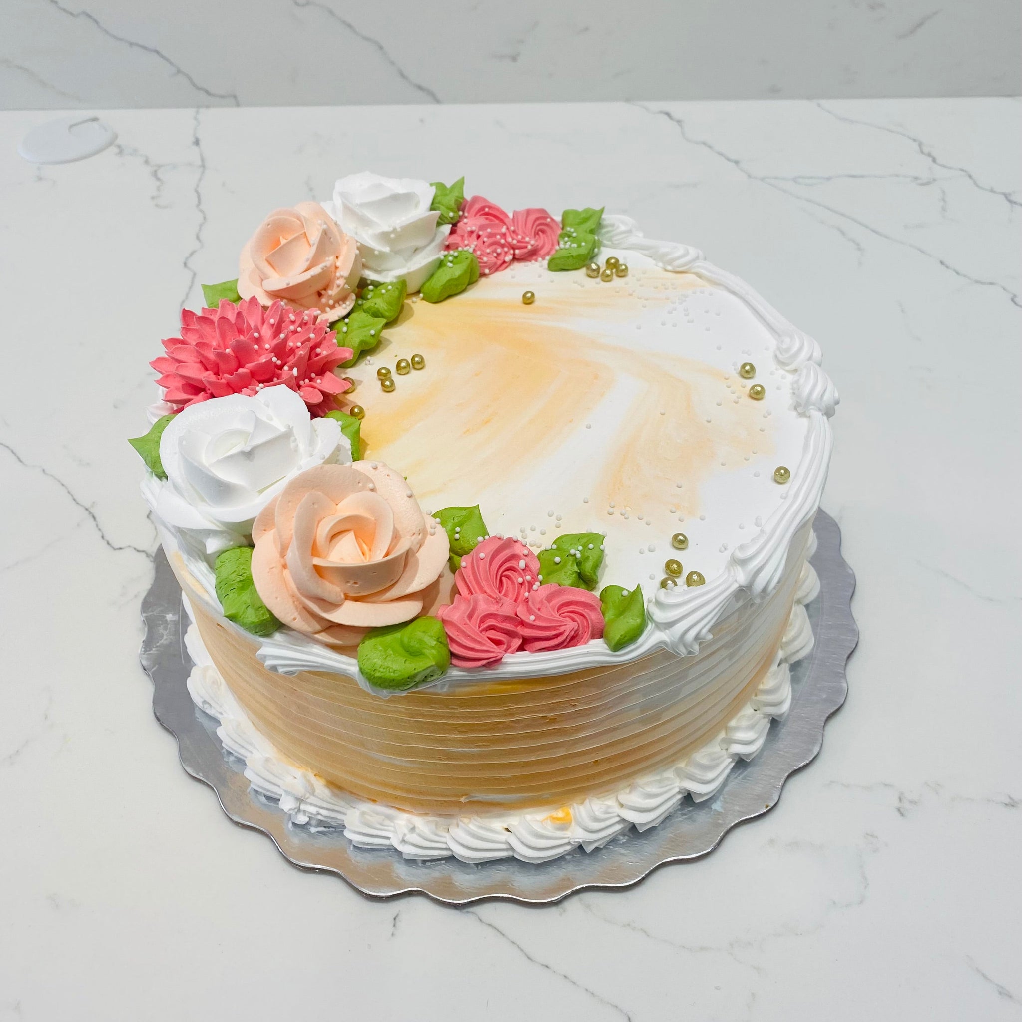 ORANGE AND WHITE CREAM FLOWER CAKE