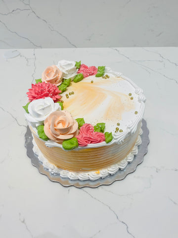 ORANGE AND WHITE CREAM FLOWER CAKE