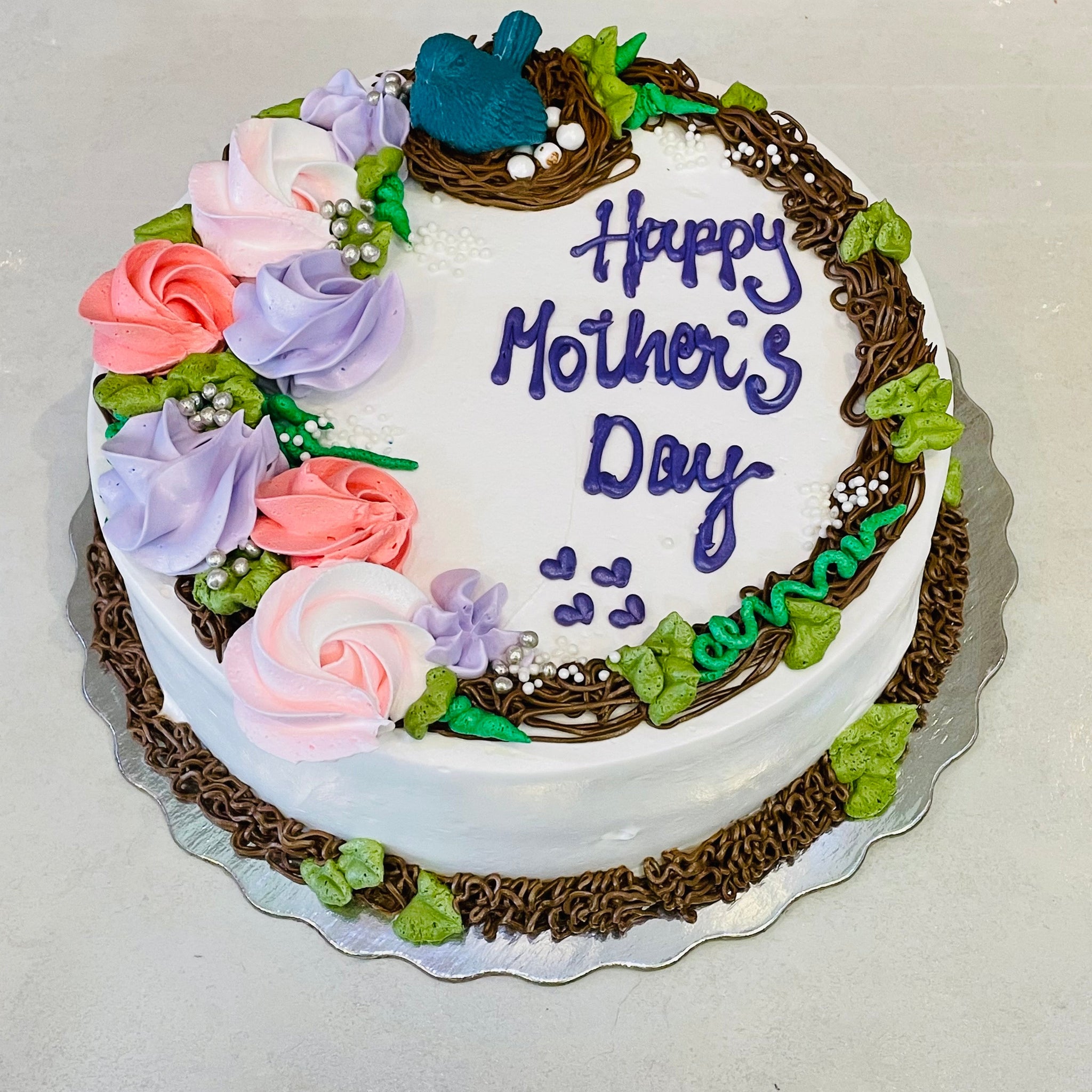 NESTLING MOTHERS DAY CAKE