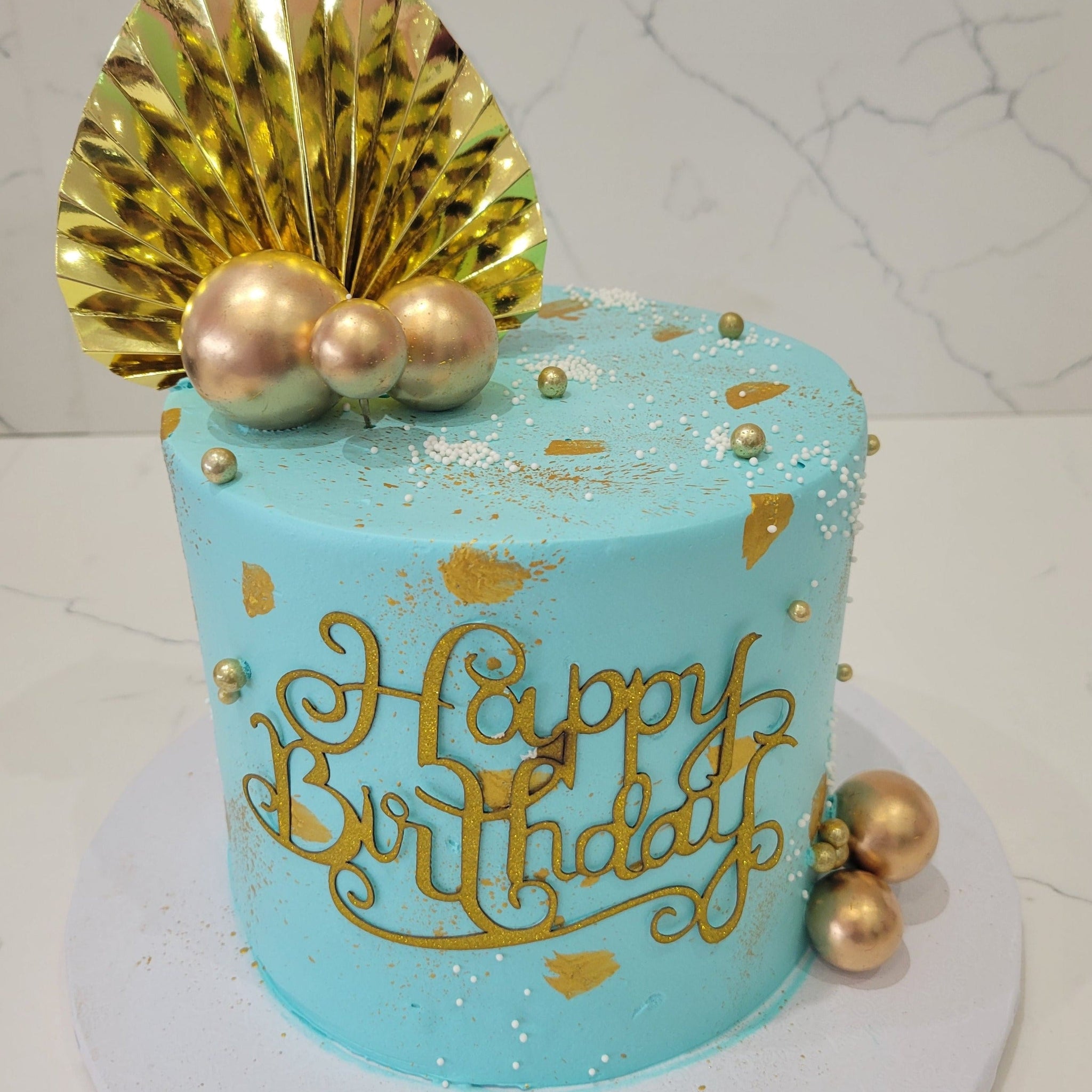 TEAL & GOLD CREAM CAKE