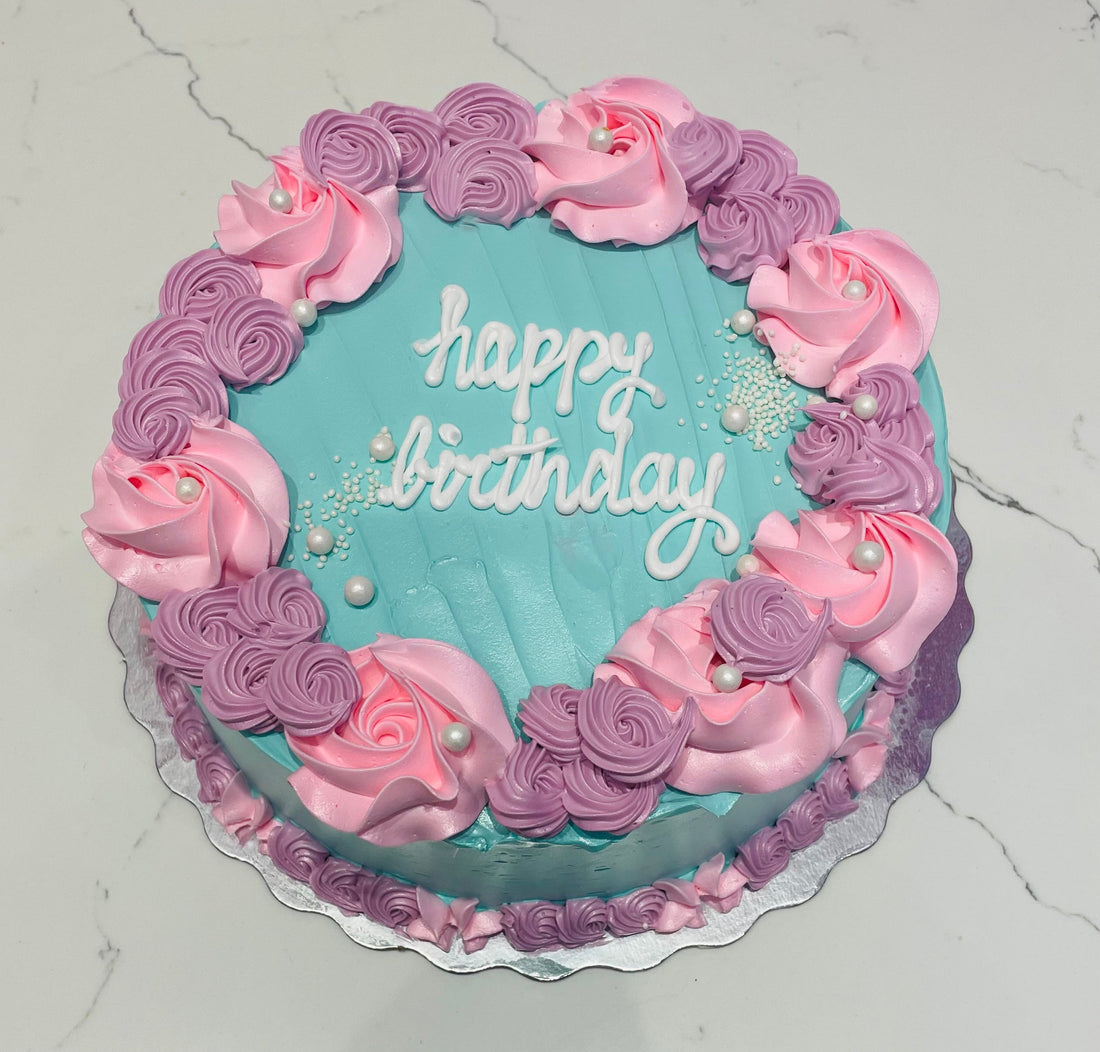 TEAL & PINK ROSETTE CAKE