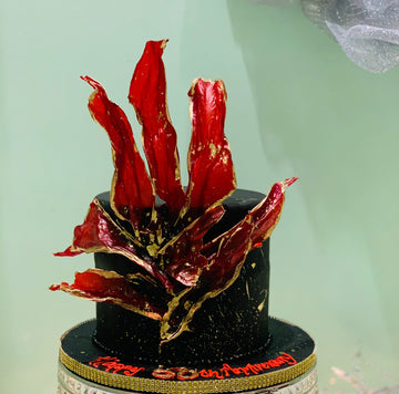 BLACK AND RED ANNIVERSARY CAKE