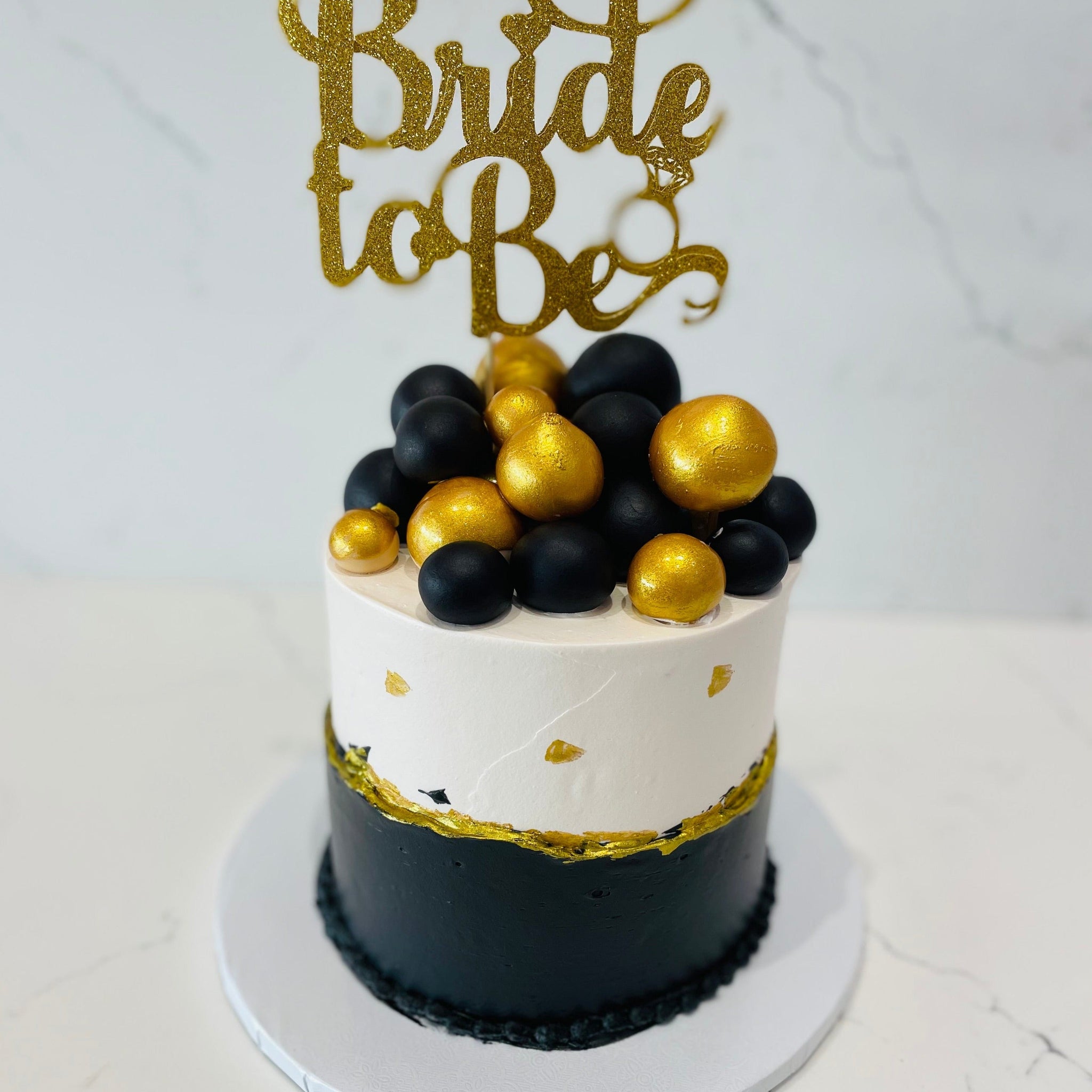BLACK AND GOLD BRIDE TO BE CAKE
