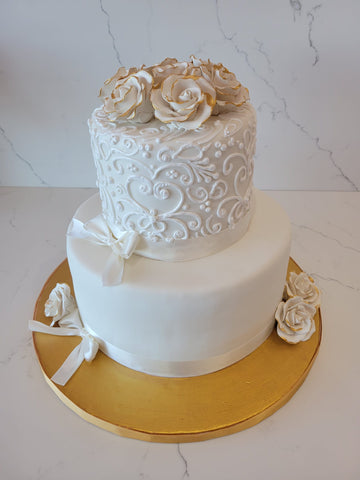 WHITE AND GOLD FONDANT TIERED CAKE