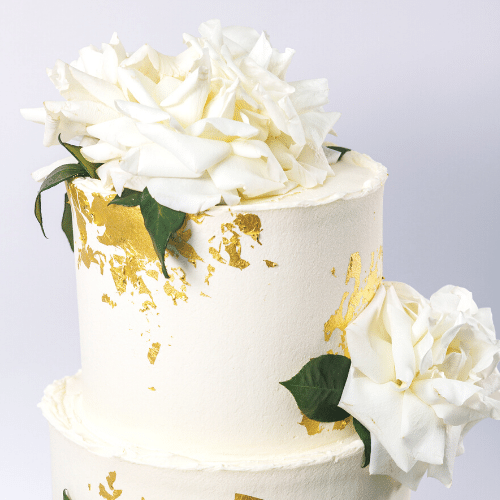 Multi-tier White Floral and Gold Wedding Cake